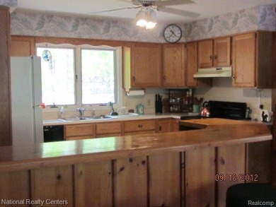 Welcome to 4010 Owl. This custom built Mahalak contemporary on Lost Lake Woods Club in Michigan - for sale on GolfHomes.com, golf home, golf lot