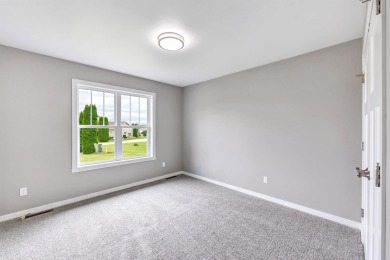 Welcome to this 3-bedroom, 2-bath home in Luxemburg, built in on NorthBrook Country Club in Wisconsin - for sale on GolfHomes.com, golf home, golf lot