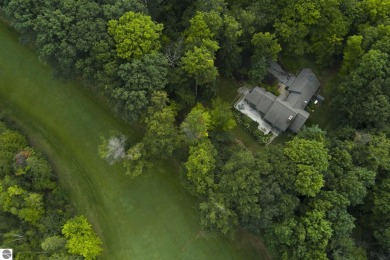 Nestled on an incredibly rare, private 2.47 wooded acres in on Leland Country Club in Michigan - for sale on GolfHomes.com, golf home, golf lot