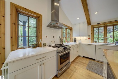 Nestled on an incredibly rare, private 2.47 wooded acres in on Leland Country Club in Michigan - for sale on GolfHomes.com, golf home, golf lot