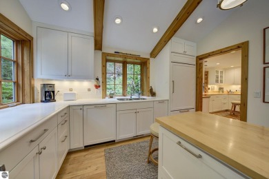 Nestled on an incredibly rare, private 2.47 wooded acres in on Leland Country Club in Michigan - for sale on GolfHomes.com, golf home, golf lot