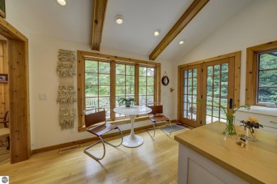 Nestled on an incredibly rare, private 2.47 wooded acres in on Leland Country Club in Michigan - for sale on GolfHomes.com, golf home, golf lot