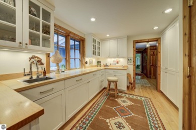 Nestled on an incredibly rare, private 2.47 wooded acres in on Leland Country Club in Michigan - for sale on GolfHomes.com, golf home, golf lot