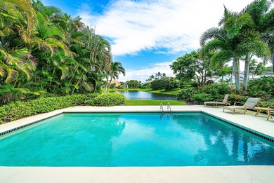 Enjoy stunning lake views from this single family home in the on Frenchmans Creek Country Club in Florida - for sale on GolfHomes.com, golf home, golf lot