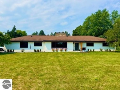 Discover 2,200 sq. ft. of luxurious, single-level living in this on Pine River Country Club in Michigan - for sale on GolfHomes.com, golf home, golf lot
