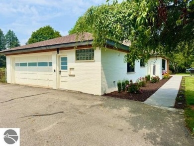 Discover 2,200 sq. ft. of luxurious, single-level living in this on Pine River Country Club in Michigan - for sale on GolfHomes.com, golf home, golf lot