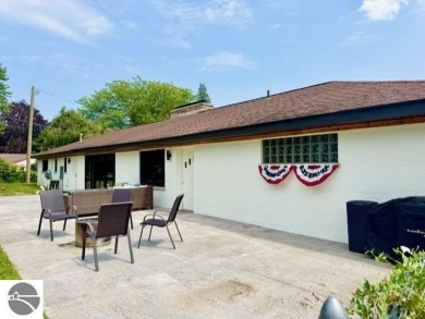Discover 2,200 sq. ft. of luxurious, single-level living in this on Pine River Country Club in Michigan - for sale on GolfHomes.com, golf home, golf lot