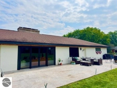 Discover 2,200 sq. ft. of luxurious, single-level living in this on Pine River Country Club in Michigan - for sale on GolfHomes.com, golf home, golf lot
