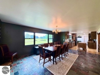 Discover 2,200 sq. ft. of luxurious, single-level living in this on Pine River Country Club in Michigan - for sale on GolfHomes.com, golf home, golf lot