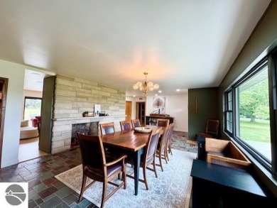 Discover 2,200 sq. ft. of luxurious, single-level living in this on Pine River Country Club in Michigan - for sale on GolfHomes.com, golf home, golf lot