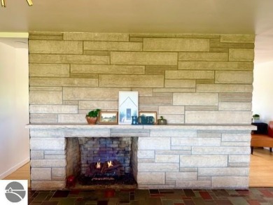 Discover 2,200 sq. ft. of luxurious, single-level living in this on Pine River Country Club in Michigan - for sale on GolfHomes.com, golf home, golf lot