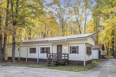 Remodeled in 2024, this 3-bedroom, 1-bath home in Lakes of the on Lakes of the North Deer Run Golf Course in Michigan - for sale on GolfHomes.com, golf home, golf lot
