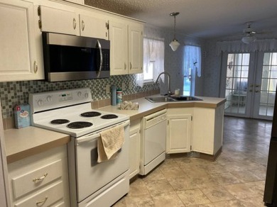 Price improvement!  What a gem. Just picture yourself living on Anglers Green Golf Course in Florida - for sale on GolfHomes.com, golf home, golf lot