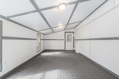 Remodeled in 2024, this 3-bedroom, 1-bath home in Lakes of the on Lakes of the North Deer Run Golf Course in Michigan - for sale on GolfHomes.com, golf home, golf lot
