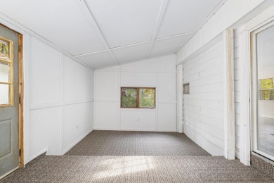 Remodeled in 2024, this 3-bedroom, 1-bath home in Lakes of the on Lakes of the North Deer Run Golf Course in Michigan - for sale on GolfHomes.com, golf home, golf lot