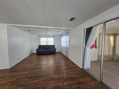 LAND OWNED 2-bedroom 2 bath manufactured home in Zellwood on Zellwood Station Country Club in Florida - for sale on GolfHomes.com, golf home, golf lot