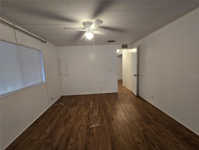 LAND OWNED 2-bedroom 2 bath manufactured home in Zellwood on Zellwood Station Country Club in Florida - for sale on GolfHomes.com, golf home, golf lot