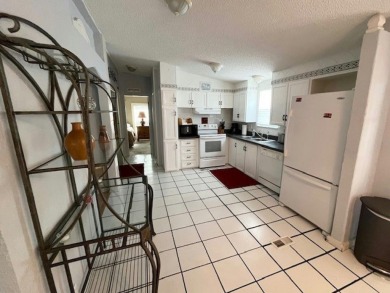 If you've been searching for a quaint, affordable stucco home on Del Tura Golf and Country Club in Florida - for sale on GolfHomes.com, golf home, golf lot