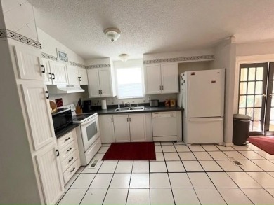 If you've been searching for a quaint, affordable stucco home on Del Tura Golf and Country Club in Florida - for sale on GolfHomes.com, golf home, golf lot