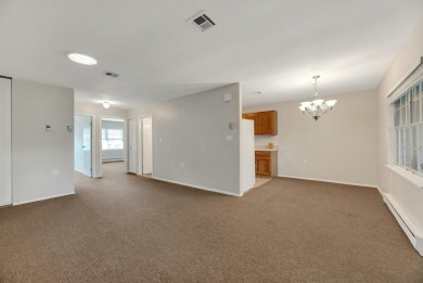 Move right into this beautifully maintained two-bedroom on Leisure Village Golf Course in New York - for sale on GolfHomes.com, golf home, golf lot