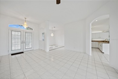 Explore this EXPANSIVE residence featuring a SPLIT BEDROOM on Pinemoor West Golf Club in Florida - for sale on GolfHomes.com, golf home, golf lot