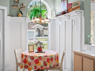 This beautifully maintained concrete block and stucco 'Doral' on Royal Oaks Golf Club in Florida - for sale on GolfHomes.com, golf home, golf lot