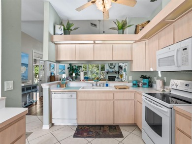 This beautifully maintained concrete block and stucco 'Doral' on Royal Oaks Golf Club in Florida - for sale on GolfHomes.com, golf home, golf lot