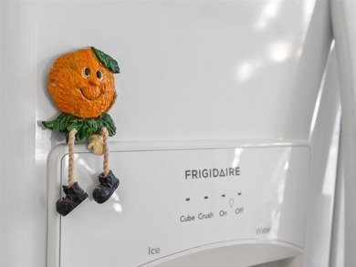 This beautifully maintained concrete block and stucco 'Doral' on Royal Oaks Golf Club in Florida - for sale on GolfHomes.com, golf home, golf lot