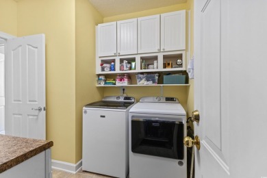 Enjoy your own private, heated pool with a screened enclosure on TPC of Myrtle Beach in South Carolina - for sale on GolfHomes.com, golf home, golf lot