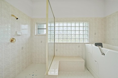 Explore this EXPANSIVE residence featuring a SPLIT BEDROOM on Pinemoor West Golf Club in Florida - for sale on GolfHomes.com, golf home, golf lot