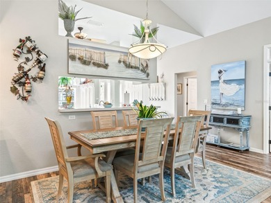 This beautifully maintained concrete block and stucco 'Doral' on Royal Oaks Golf Club in Florida - for sale on GolfHomes.com, golf home, golf lot