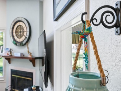 This beautifully maintained concrete block and stucco 'Doral' on Royal Oaks Golf Club in Florida - for sale on GolfHomes.com, golf home, golf lot