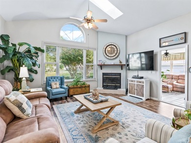 This beautifully maintained concrete block and stucco 'Doral' on Royal Oaks Golf Club in Florida - for sale on GolfHomes.com, golf home, golf lot