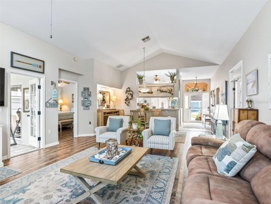 This beautifully maintained concrete block and stucco 'Doral' on Royal Oaks Golf Club in Florida - for sale on GolfHomes.com, golf home, golf lot