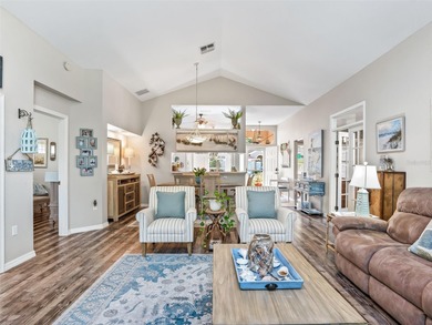 This beautifully maintained concrete block and stucco 'Doral' on Royal Oaks Golf Club in Florida - for sale on GolfHomes.com, golf home, golf lot