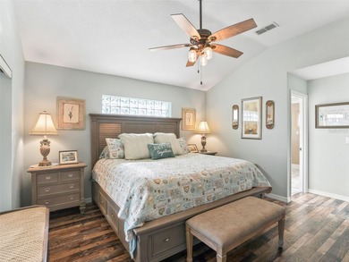 This beautifully maintained concrete block and stucco 'Doral' on Royal Oaks Golf Club in Florida - for sale on GolfHomes.com, golf home, golf lot