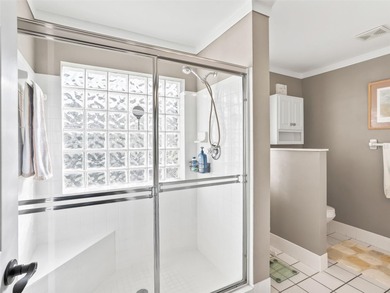 This beautifully maintained concrete block and stucco 'Doral' on Royal Oaks Golf Club in Florida - for sale on GolfHomes.com, golf home, golf lot