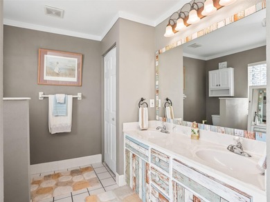 This beautifully maintained concrete block and stucco 'Doral' on Royal Oaks Golf Club in Florida - for sale on GolfHomes.com, golf home, golf lot