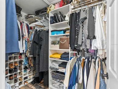 This beautifully maintained concrete block and stucco 'Doral' on Royal Oaks Golf Club in Florida - for sale on GolfHomes.com, golf home, golf lot