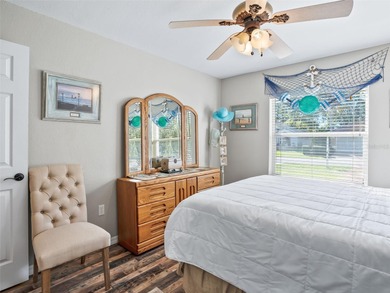 This beautifully maintained concrete block and stucco 'Doral' on Royal Oaks Golf Club in Florida - for sale on GolfHomes.com, golf home, golf lot