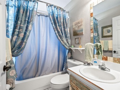 This beautifully maintained concrete block and stucco 'Doral' on Royal Oaks Golf Club in Florida - for sale on GolfHomes.com, golf home, golf lot