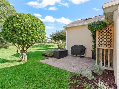 This beautifully maintained concrete block and stucco 'Doral' on Royal Oaks Golf Club in Florida - for sale on GolfHomes.com, golf home, golf lot