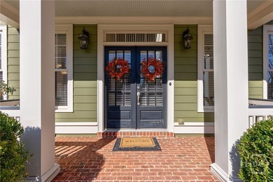 Inviting and charming, the rocking-chair brick front porch on Reunion Golf Club in Georgia - for sale on GolfHomes.com, golf home, golf lot