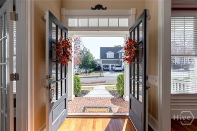 Inviting and charming, the rocking-chair brick front porch on Reunion Golf Club in Georgia - for sale on GolfHomes.com, golf home, golf lot