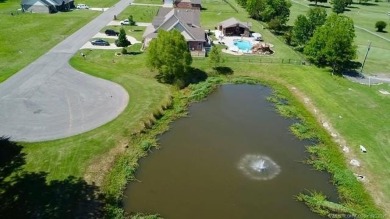 Luxurious 6 bedroom, 4.5 bath home on the 5th hole of Riverlinks on Tahlequah City Golf Course in Oklahoma - for sale on GolfHomes.com, golf home, golf lot