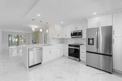 Fully renovated 2-Bed, 2-Bath Condo in 55+Community at WYNMOOR on Wynmoor Golf Course in Florida - for sale on GolfHomes.com, golf home, golf lot