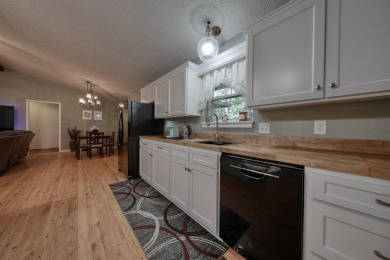 Welcome to this beautifully maintained and updated home in the on Hide-A-Way Lake Golf Course in Texas - for sale on GolfHomes.com, golf home, golf lot