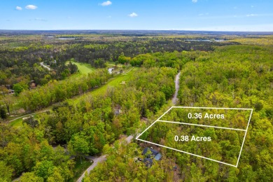 Escape to the beauty of Michaywe with this .74 acre wooded on Michaywe Pines Course in Michigan - for sale on GolfHomes.com, golf home, golf lot