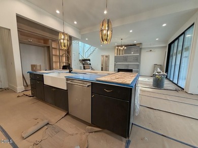 Stunning luxury home and pool house on NRCC 9th Fairway of the on North Ridge Country Club in North Carolina - for sale on GolfHomes.com, golf home, golf lot