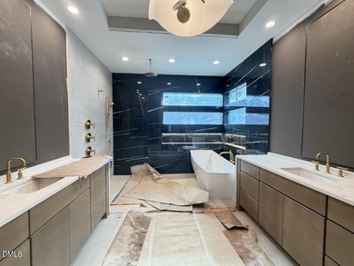 Stunning luxury home and pool house on NRCC 9th Fairway of the on North Ridge Country Club in North Carolina - for sale on GolfHomes.com, golf home, golf lot